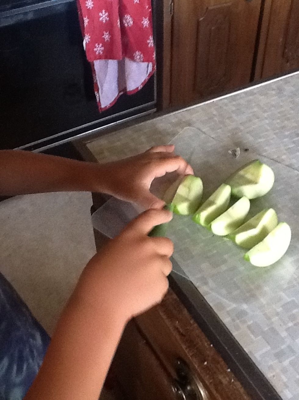 Now, it's time to cut the quarters in half. (this might be a cutting a kid can do if they are careful!)