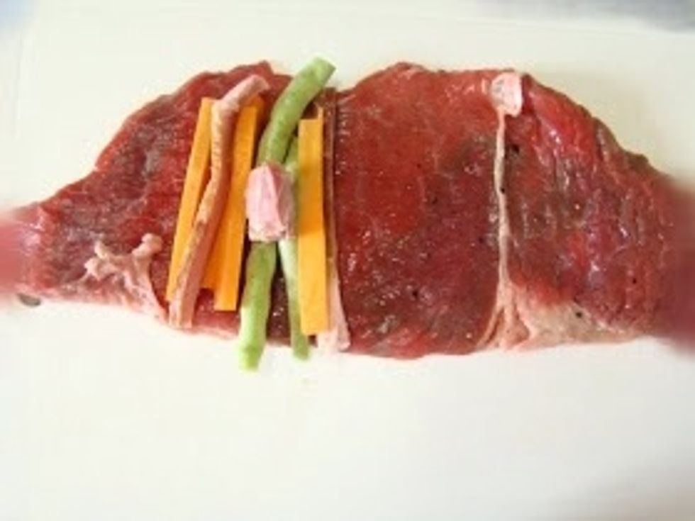 Now it's time to fill them in..put your carrots bacon and bell pepper on (I'm using peas) because like I said I didn't have any bell peppers in hand