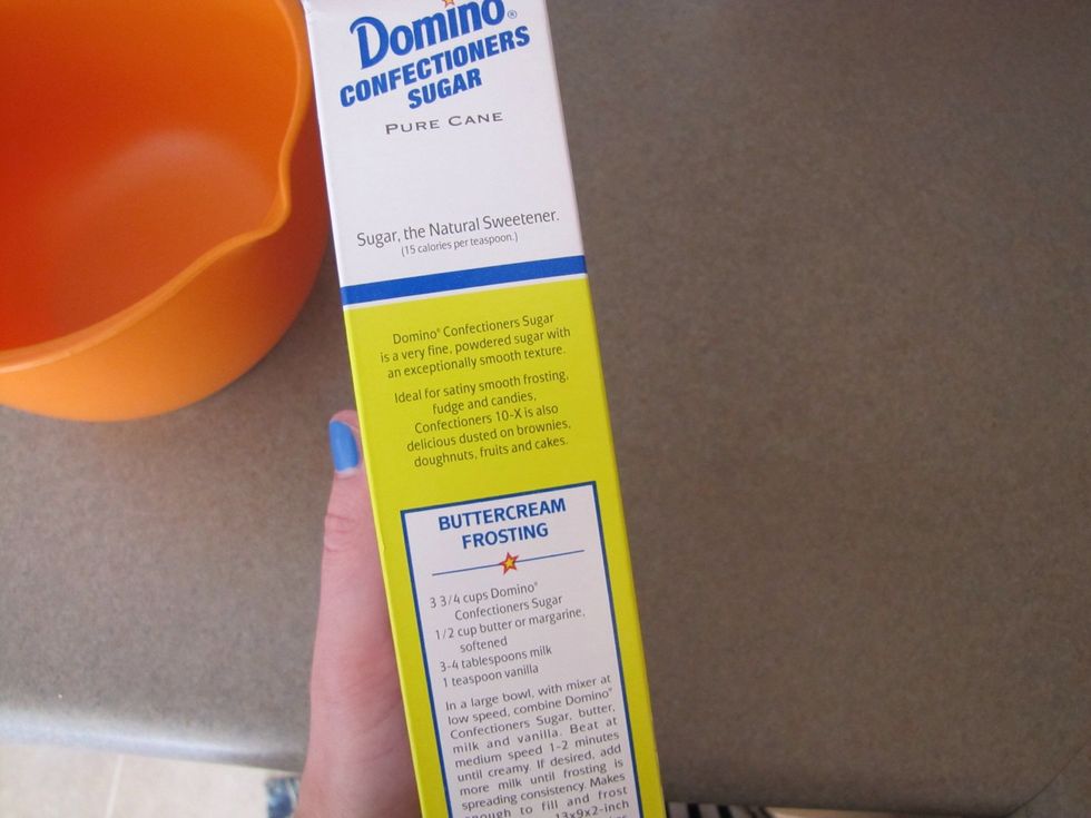 Now it's time to make a yummy buttercream frosting to ice the sugar cookies with! (The recipe is on the side of the Domino's confectioners sugar box)