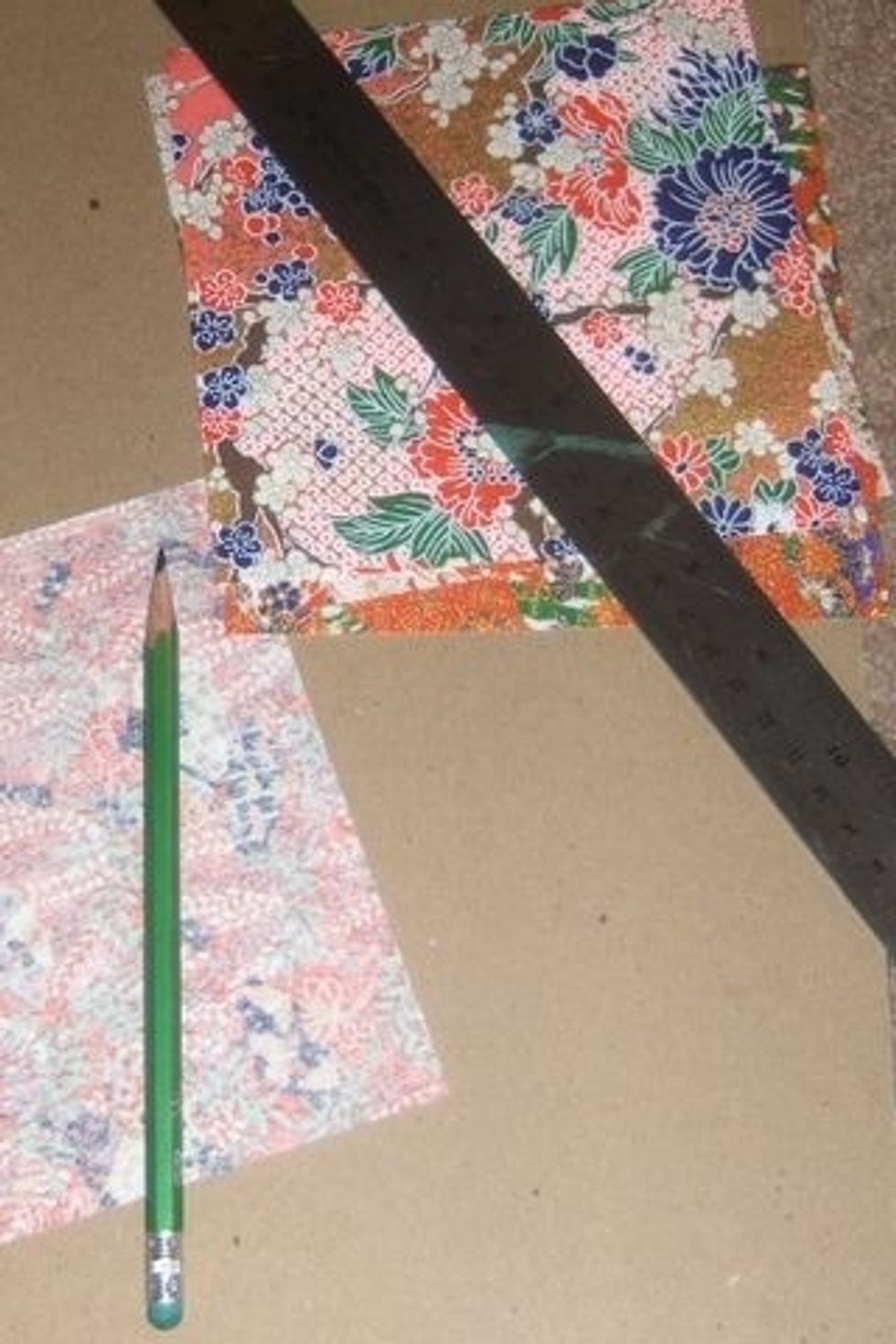Now it's time to make some origami hearts! Gather your origami paper, pencil, ruler and exacto knife.