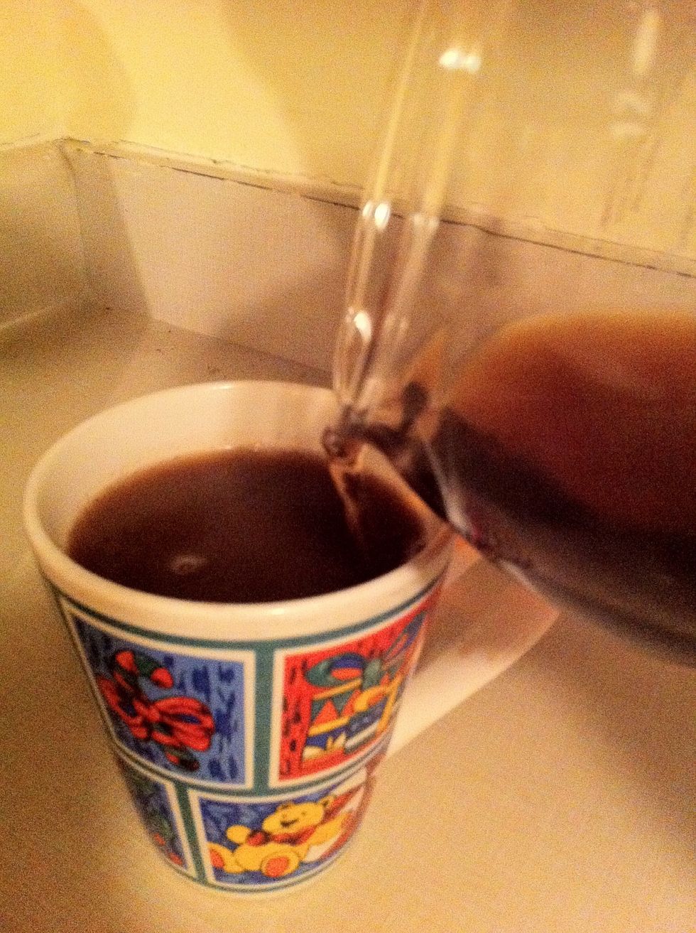 Now it's time to pour the coffee into the mug. Stir until the chunks of hot chocolate mix at the top disappear!