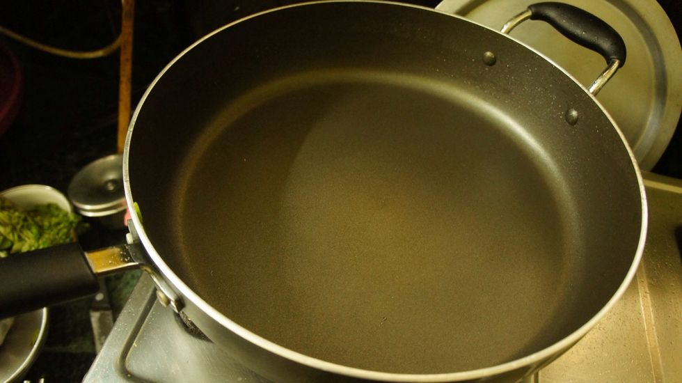 Now it's turn for frying chopped onions, green chillies and curry leaves..