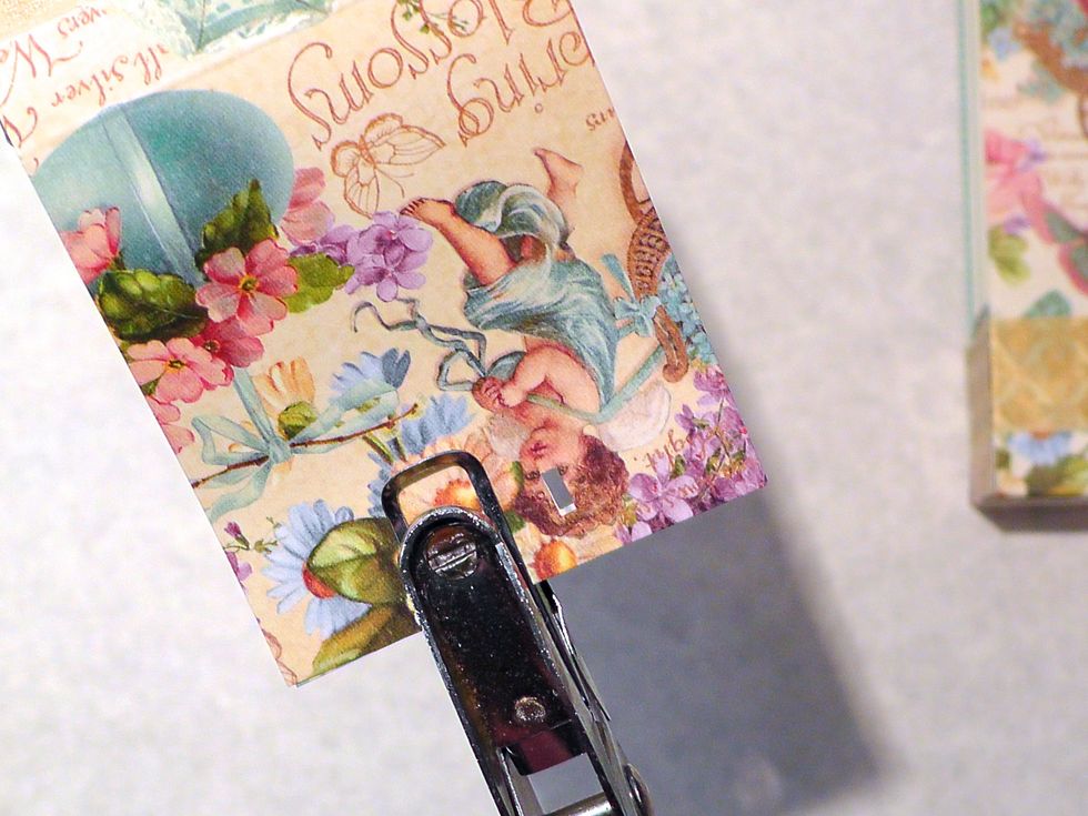 Now join the tops together and punch two holes for your ribbon