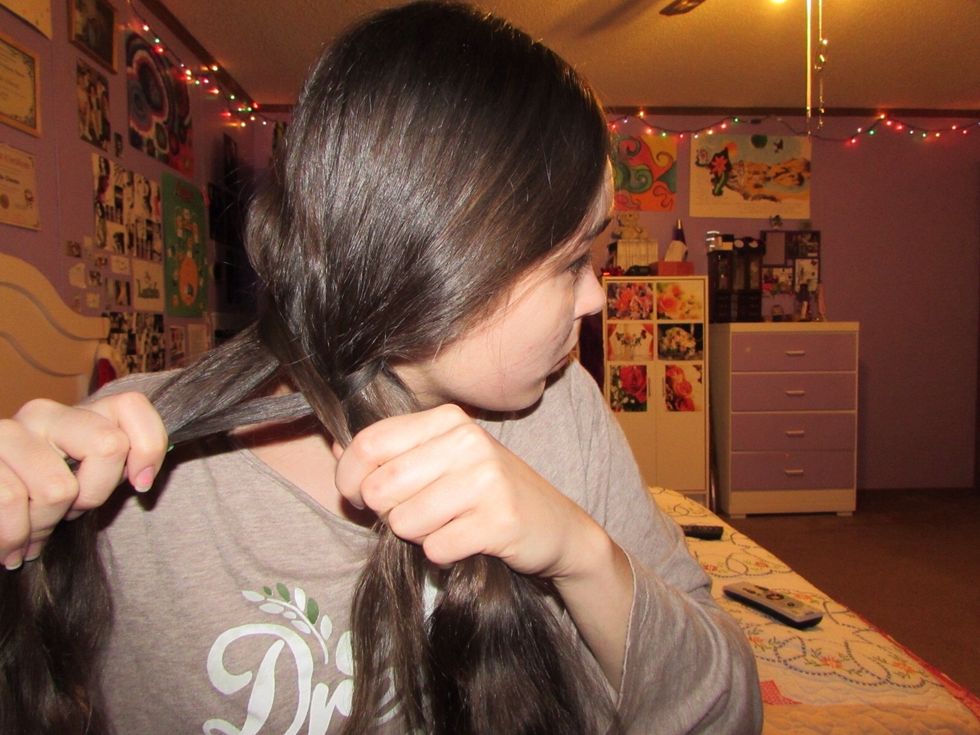 Now just like on the right side, take a SMALL strand of hair from behind your left half of hair and cross it over to the right side. Repeat this until you reach the end of your hair.