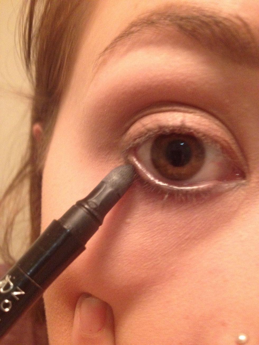 Now just smudge the line you made. I have a smudger at the end on my liner and you can also buy them as a brush, if you don't have one a cottonbuds or finger works .This liner is Avon shade "charcoal"