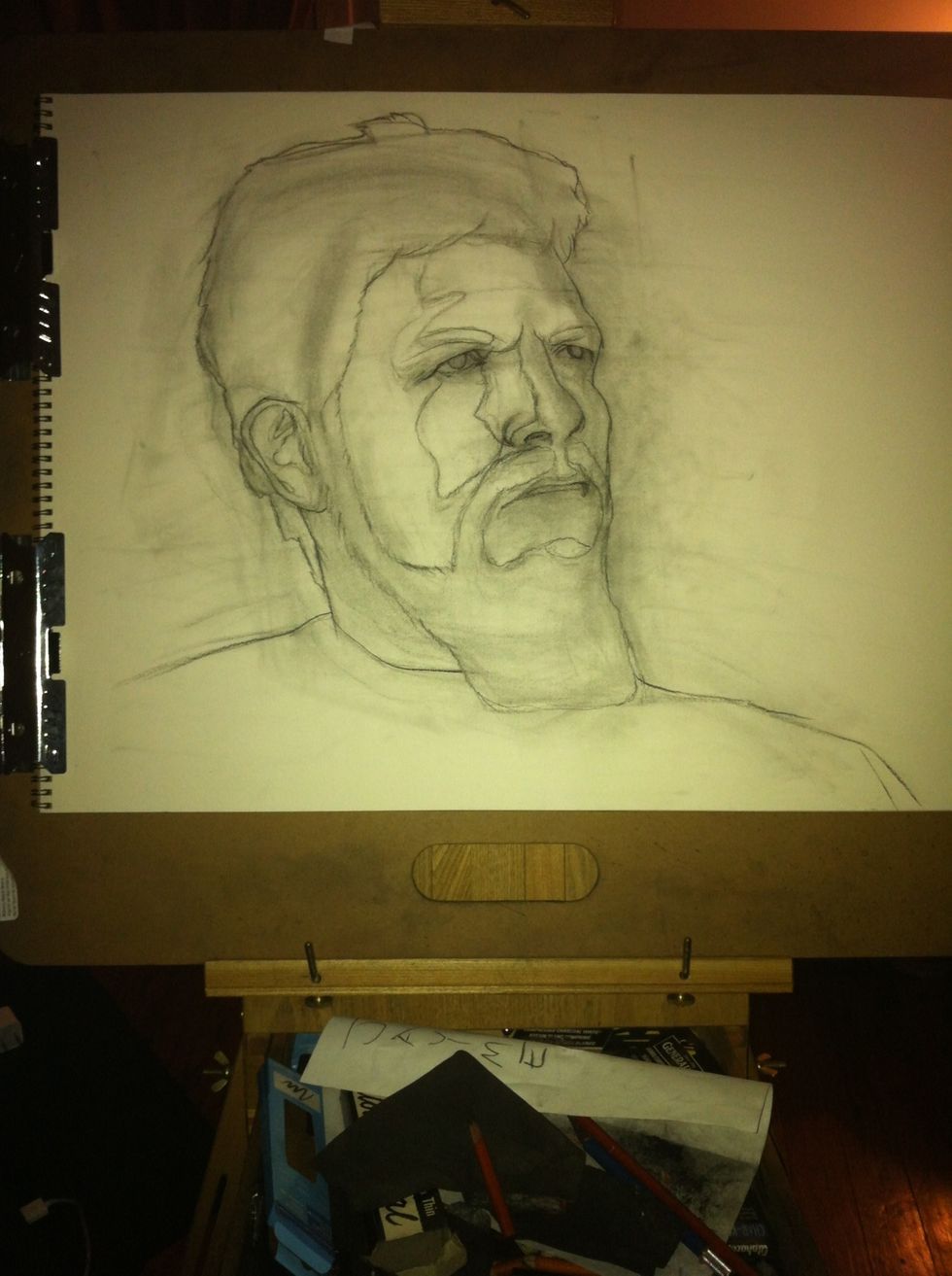 Now "knock back" some of the value from the vine charcoal using your chamois cloth. Leave just enough to use as a guide with darker charcoal. Now use your 2b charcoal pencil to lightly create lines.