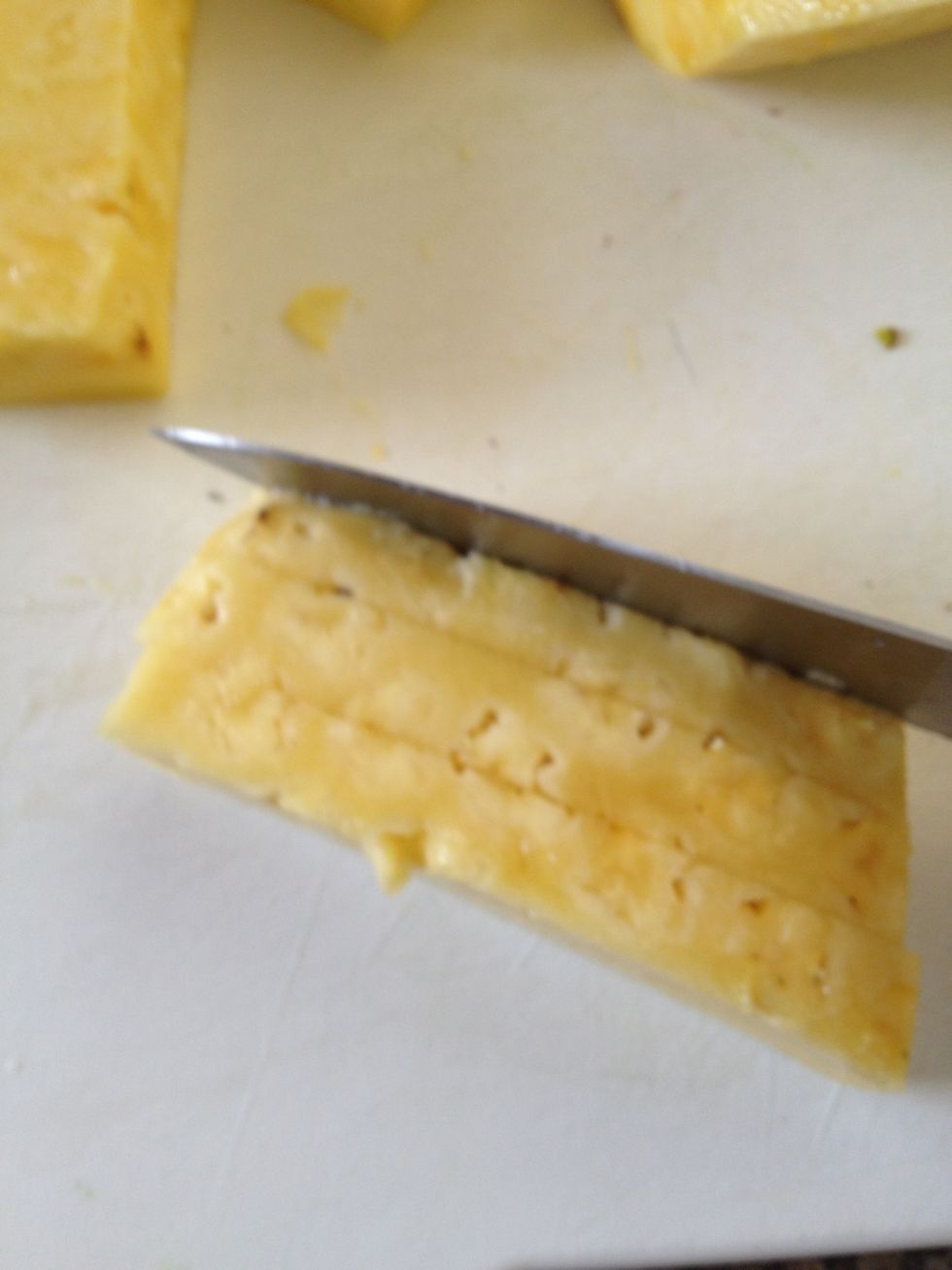 Now lay one of the cut pieces down and slice lengthwise like this