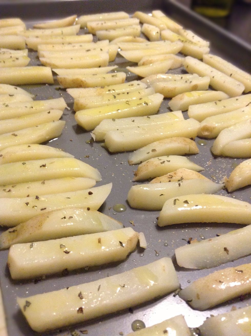 Now lay out your fries on a cookie sheet DON'T over crowd or they will never crisp up :)! Also I don't recommend using foil I find right on the pan works best!