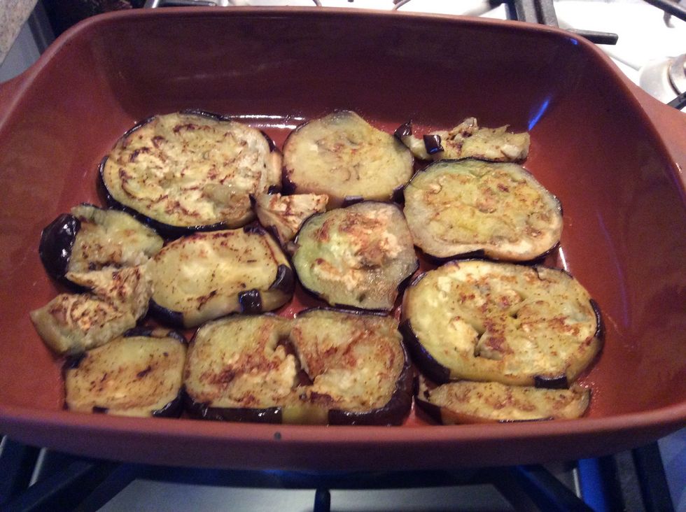 Now layer the eggplant in an oven proof dish and pour sauce and some mozzarella over the eggplant. Then lay down more eggplant and repeat this process till used up all ingredients.