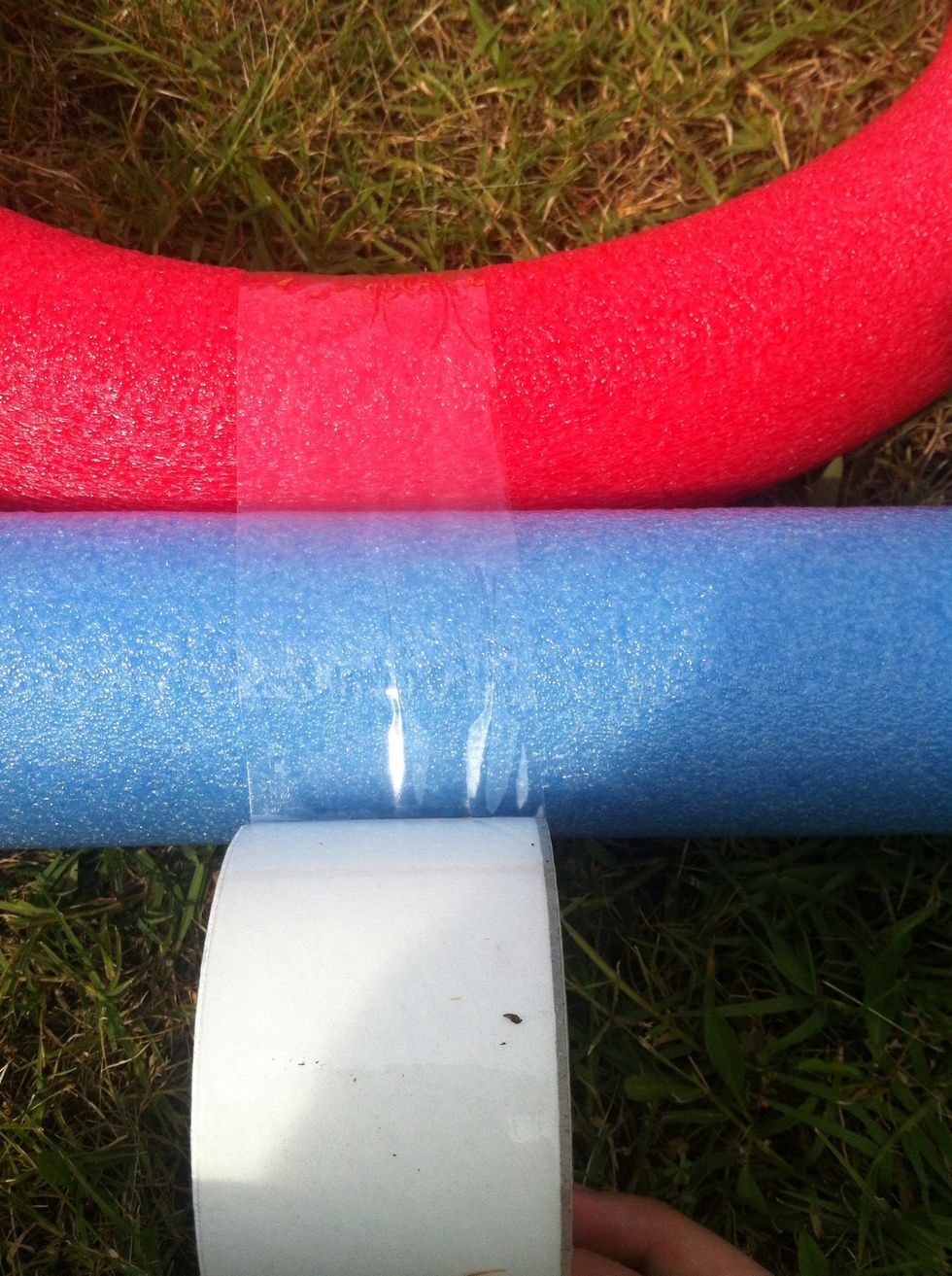 Now, leave about 3-4 inches on the top. Tape the circle to the straight pole.
