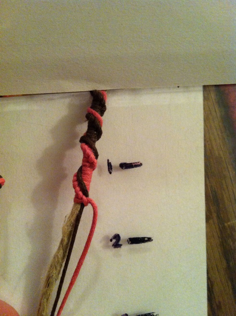 Now leave out your first color and make a staircase section with your second color cord. Wrap and secure your first color. Continent until you've reached a length of your choice.