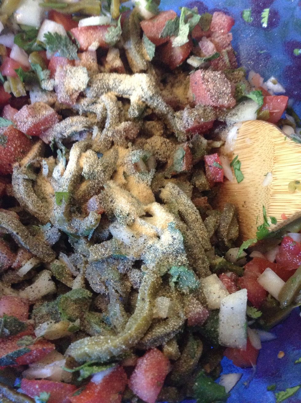 Now let's add our spices - salt, pepper and garlic powder or garlic salt. Again, taste to preference but don't add too much salt yet because the cheese we're going to use is salty.