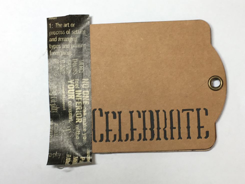 Now let's bind the outside. Place a piece of washi tape along the edge of the front cover.