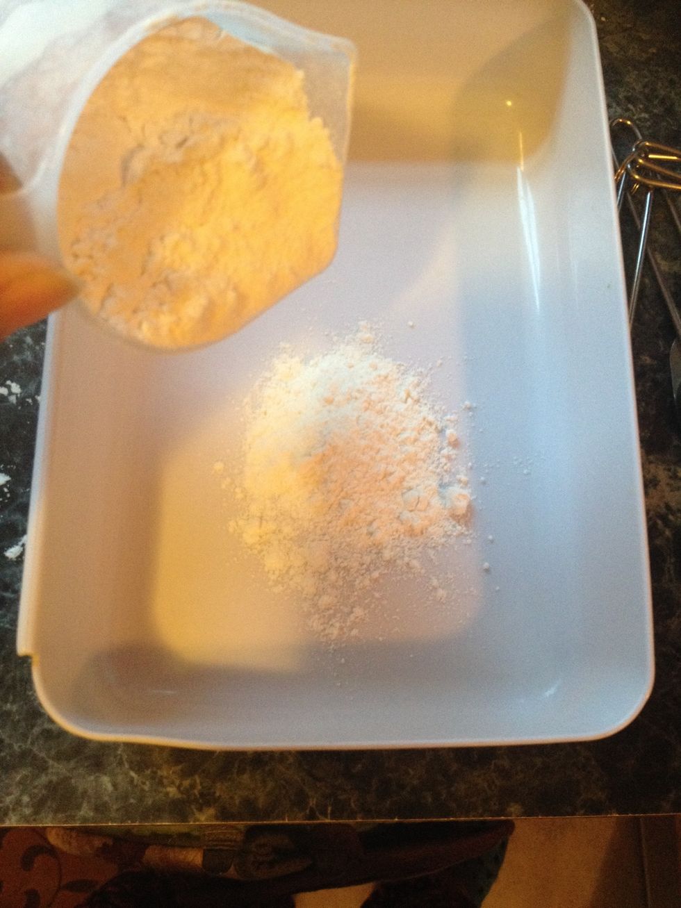 Now let's get 3 bowls. Take the flour and add it to one bowl.