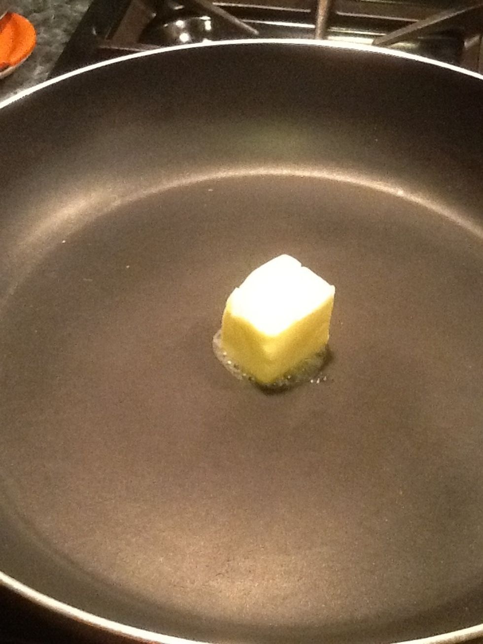 Now let's get ready to make the stuffing. Take a pan and set it over medium heat. Add the butter