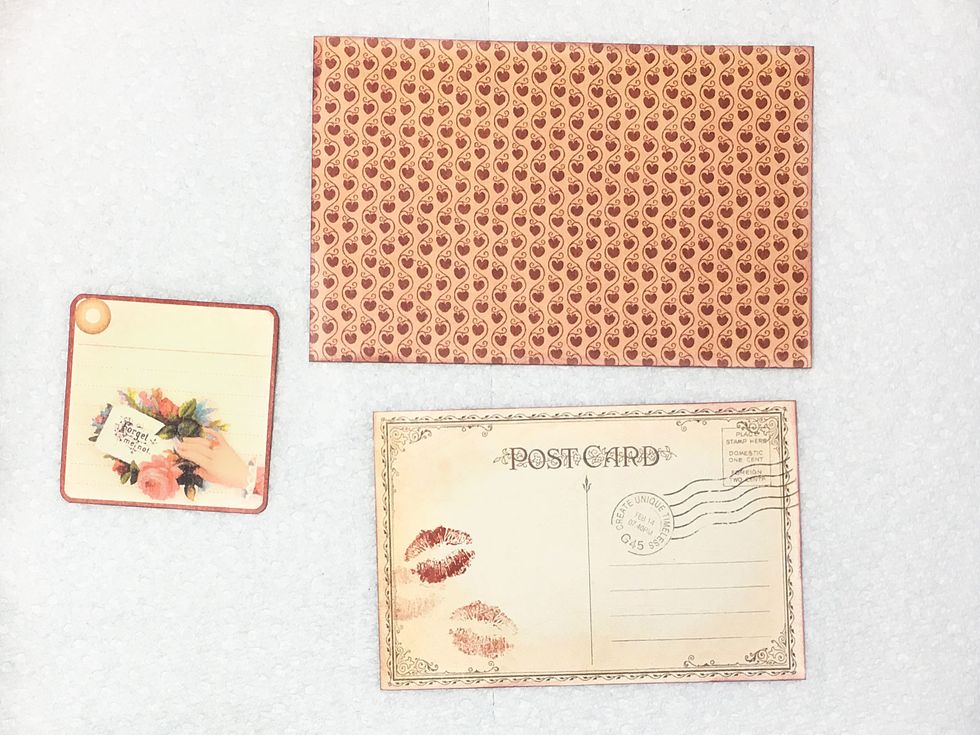 Now let's make a valentine! Locate the Post Card cut-apart shown & the smaller tag on the February Place in Time Cut-Aparts. Cut a rectangle 6" x 3 7/8" from design paper. Ink & distress as desired.