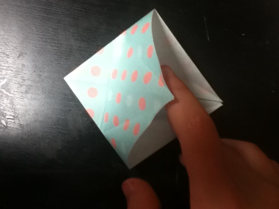 Now lift up the flap on the bottom, only coming up to the crease you made in step 15.