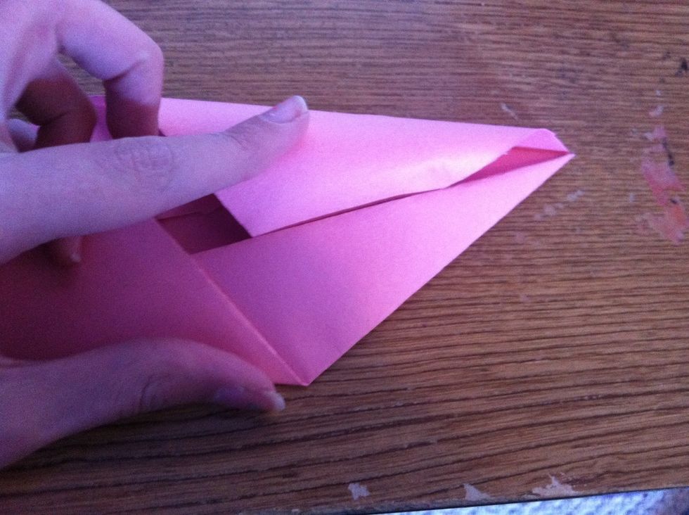 Now lift up those flaps you just made, and push them under the two tabs.