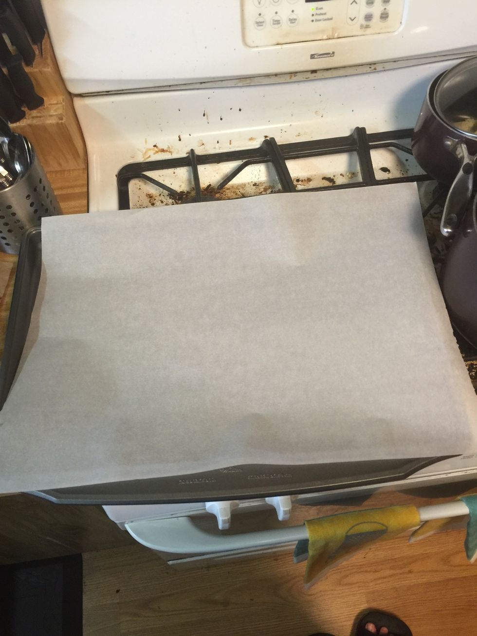 Now line a baking sheet with a piece of parchment paper if you don't have parchment paper use aluminum foil