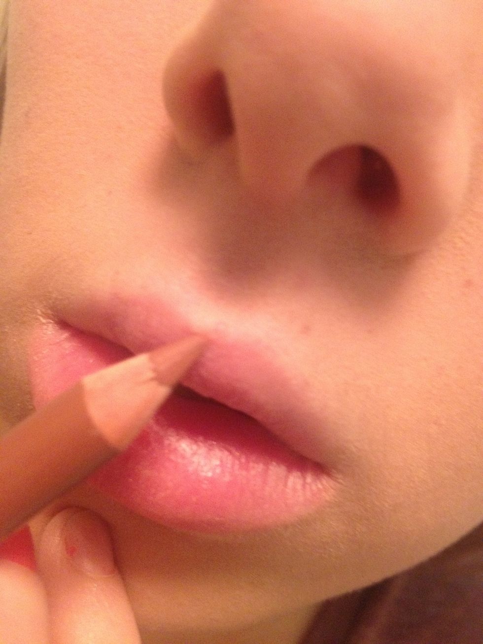 Now line your lips with your lip liner. I'm using Cargo in Mooch