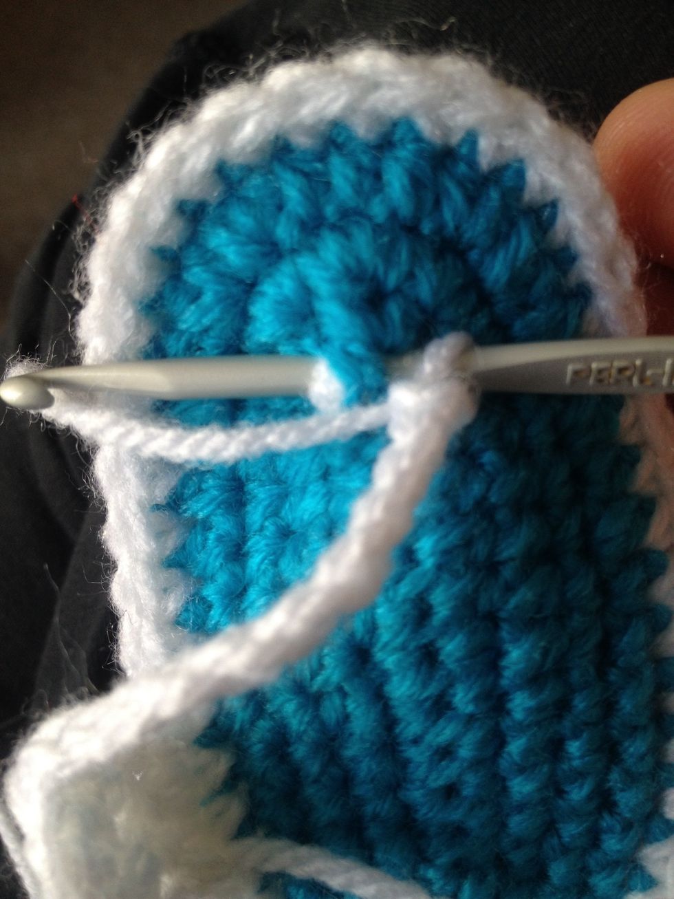 Now look for the middle centre at the top part of sole ( where toes go) now we slip stitch through BOTH soles