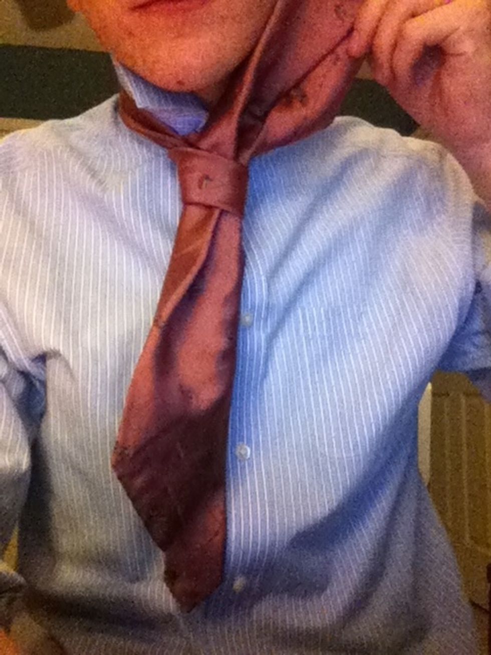 Now loosen the short, thin piece at the knot and slide the long, fat piece through. Depending on how much you loosen it, this might cause your tie to be too long. Restart and adjust accordingly.