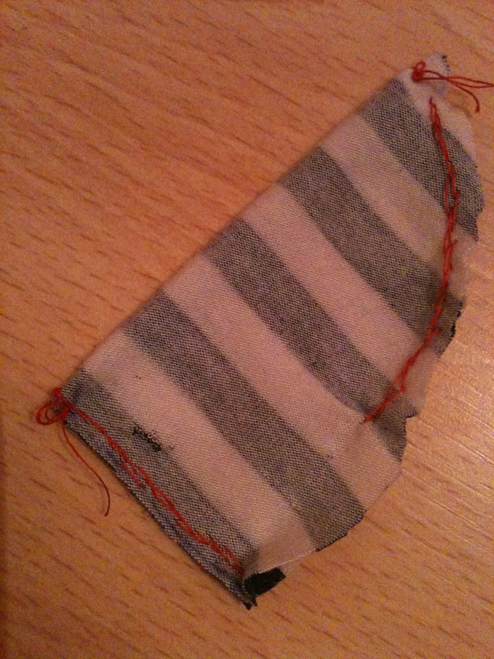 Now make a little slit on each side, as I have here. This is for the ear.