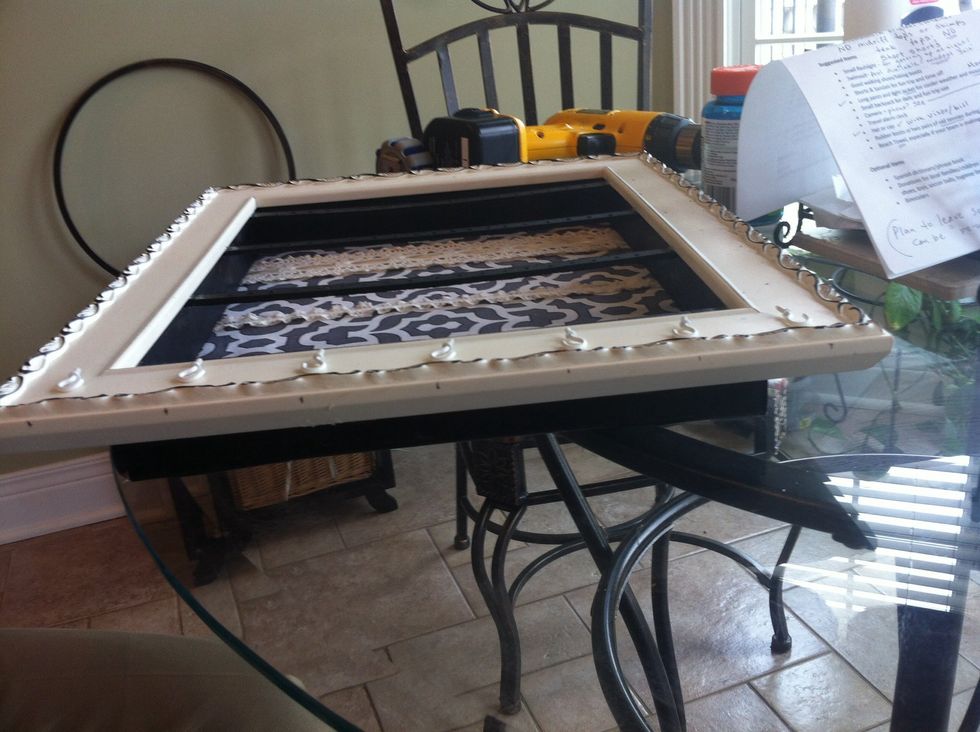 Now make little pencil marks on the bottom of the frame for reference