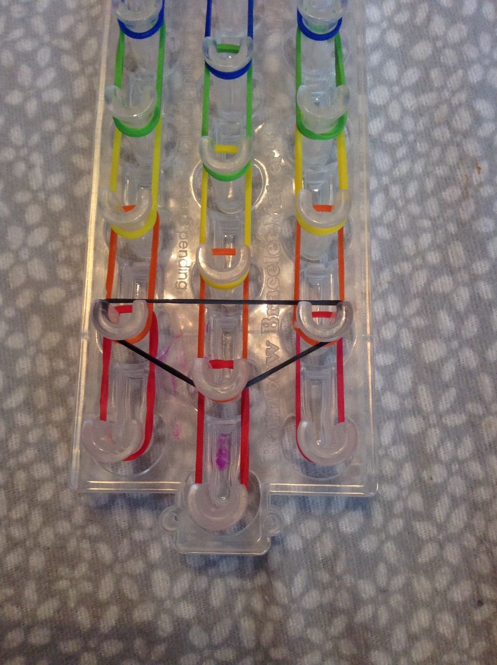 Now make upside down triangle all the way up the loom. DONT make one on the first one. As you can see.