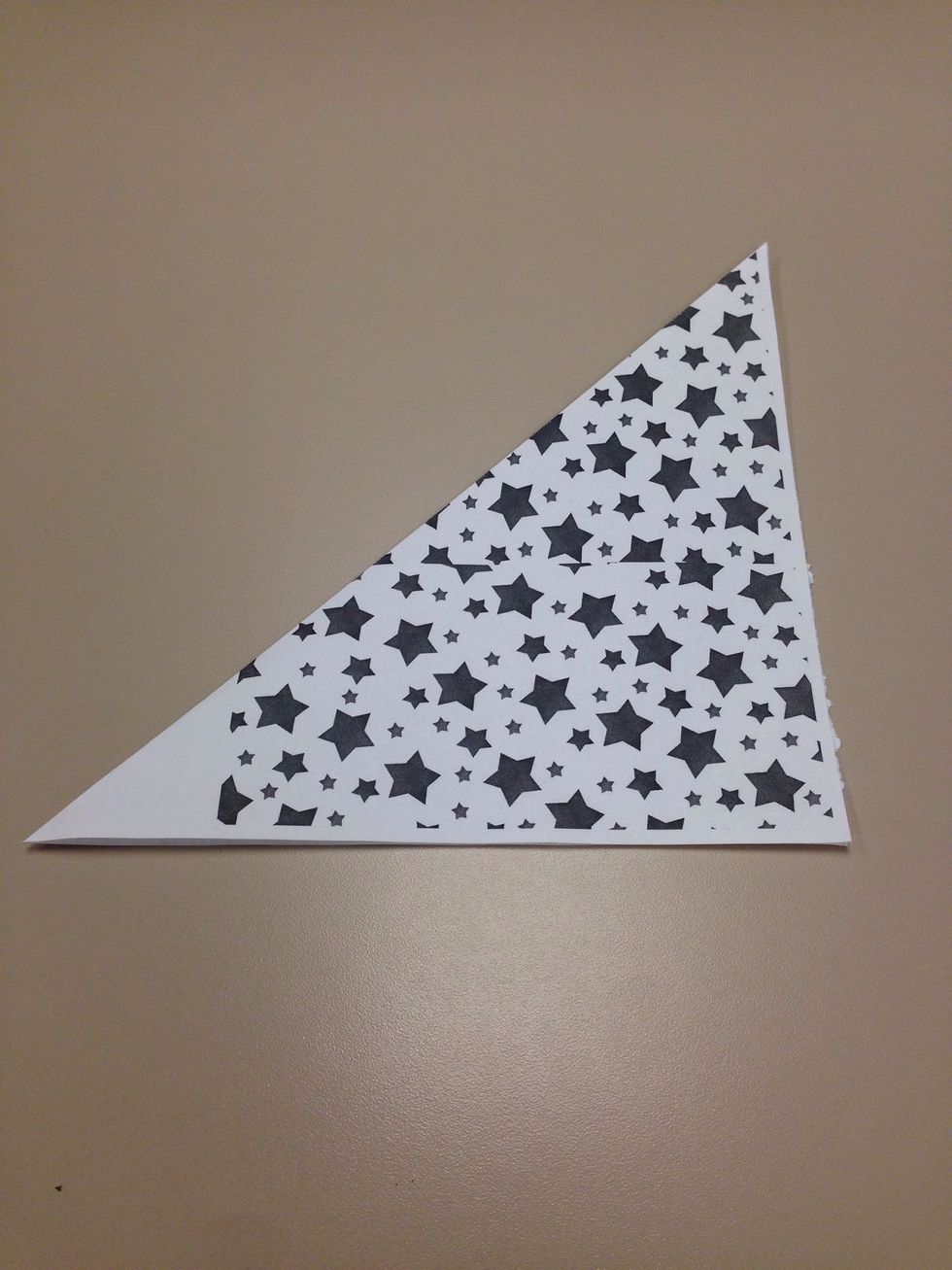 Now make vivid diagonal folds and crease it