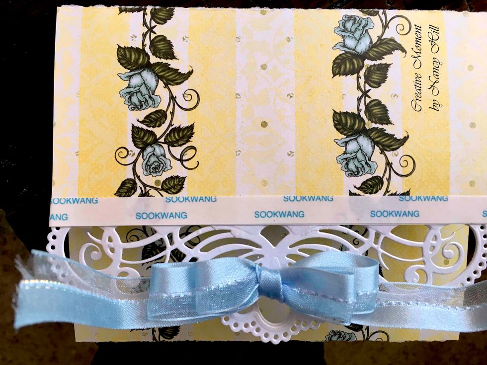 Now make your bow and leave enough ribbon to overlap on the other side of the card.  Use 1/2" wide Scor-Tape across the card and about 1/2" on the other side of the card to tape the ribbon and bow.