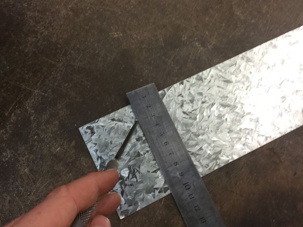Now mark the second piece of sheet metal with the scribe.
