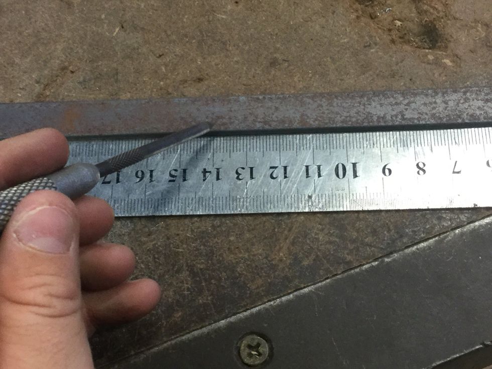 Now mark your first piece of flat bar with a metal ruler and scribe 15cm long