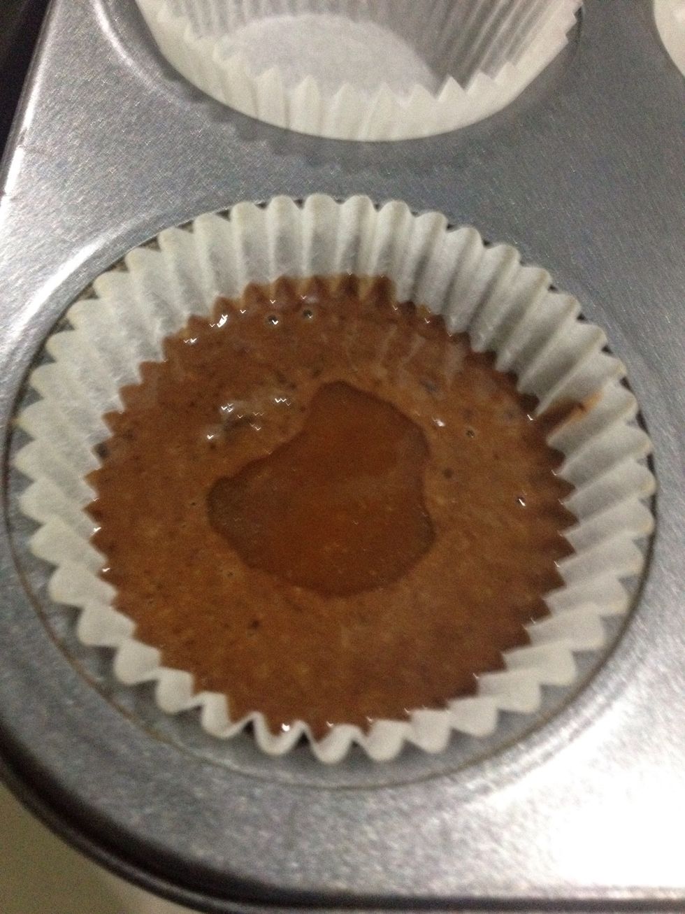 Now measure out equal amounts of batter for the cupcakes (I used an ice cream scoop) and add a little caramel in the centre. You can omit the caramel if you don't want it (but why wouldn't you....)