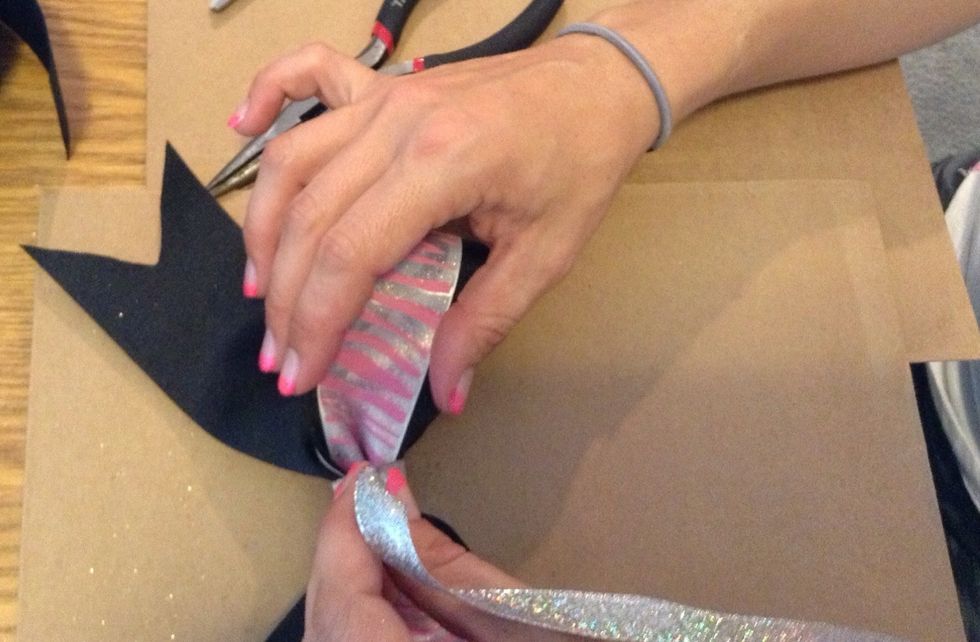 Now measure the piece of material or ribbon to use for the middle of the bow.