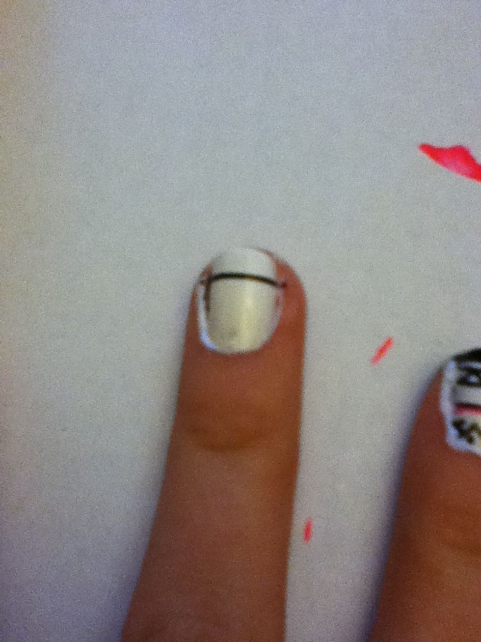 Now move on to the middle finger. Start by draw a line in the middle of the nail a shown.