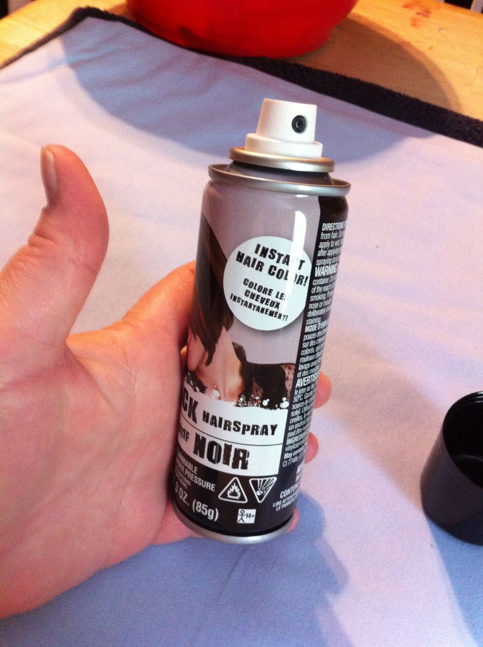 Now Ms Kay's hair is black. Dear Daughter's hair is blonde. So we got some black hairspray.