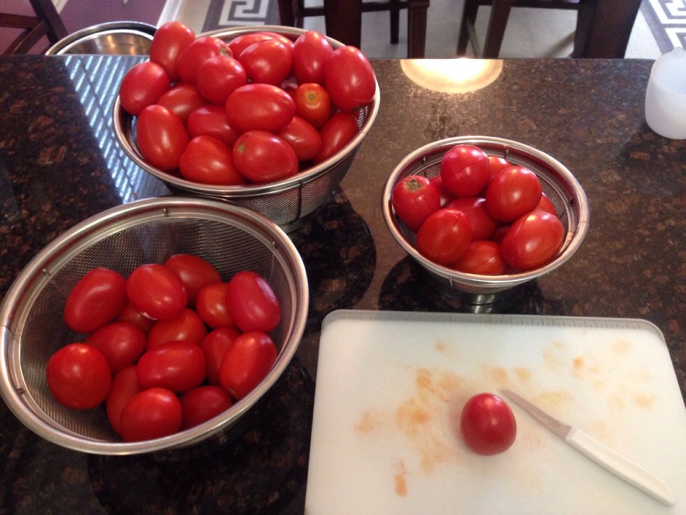Now on a cutting board with small prep knife, just give a quick "X" score to the skins of the tomatoes.