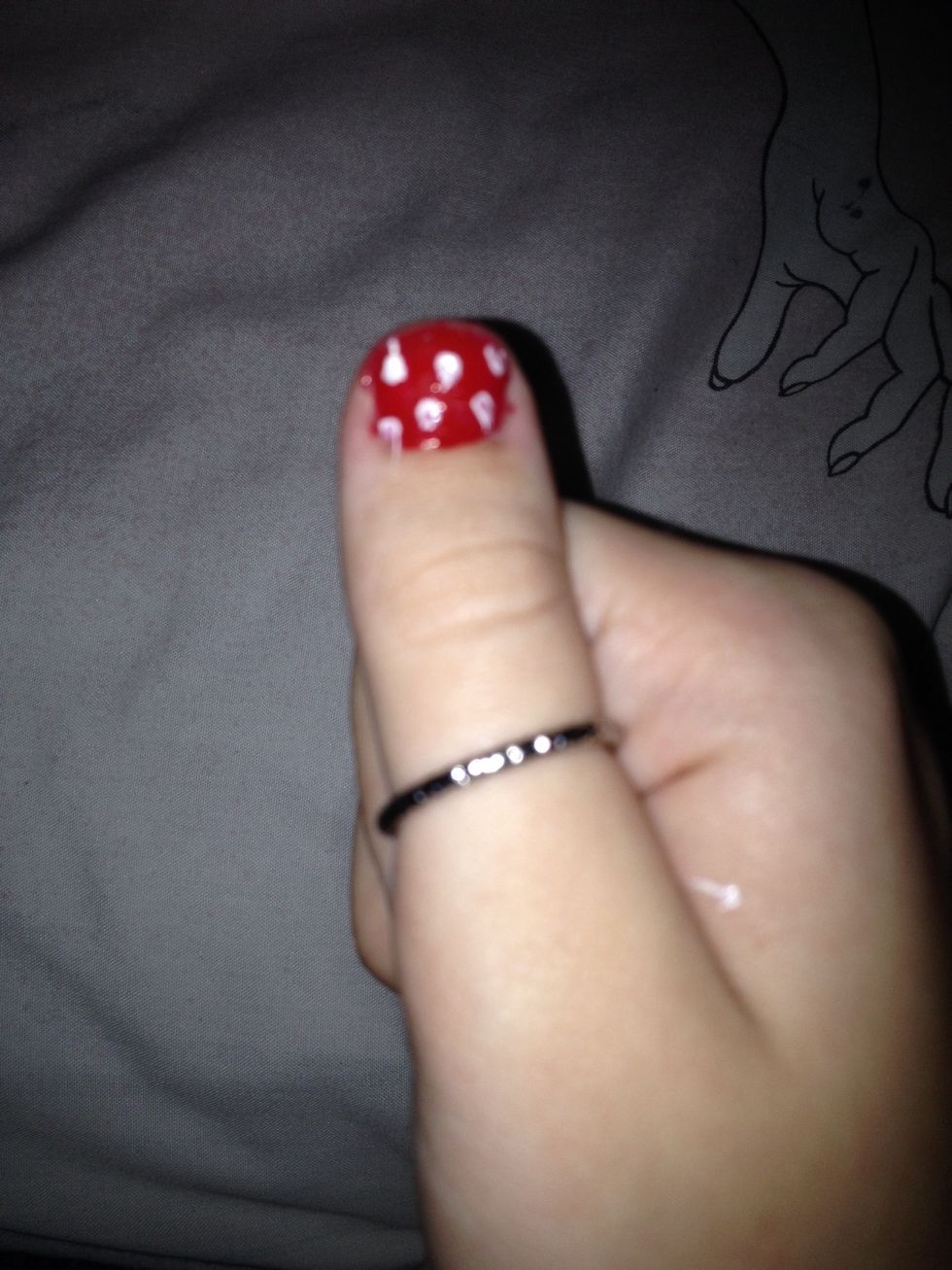 Now on the red nails do as many white dots as you want I would say a minimum of 5!