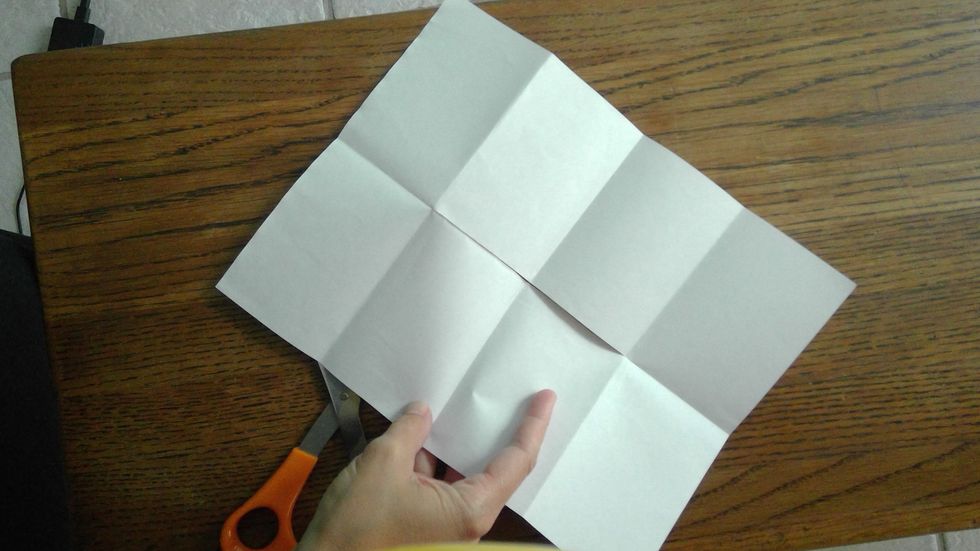 Now, open the paper. There will be a slit in the middle of the paper.
