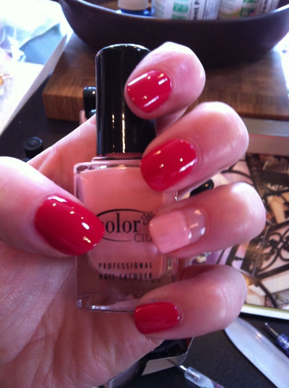 Now paint half of your ring finger with two coats of an accent color. This will be the cupcake wrapper.