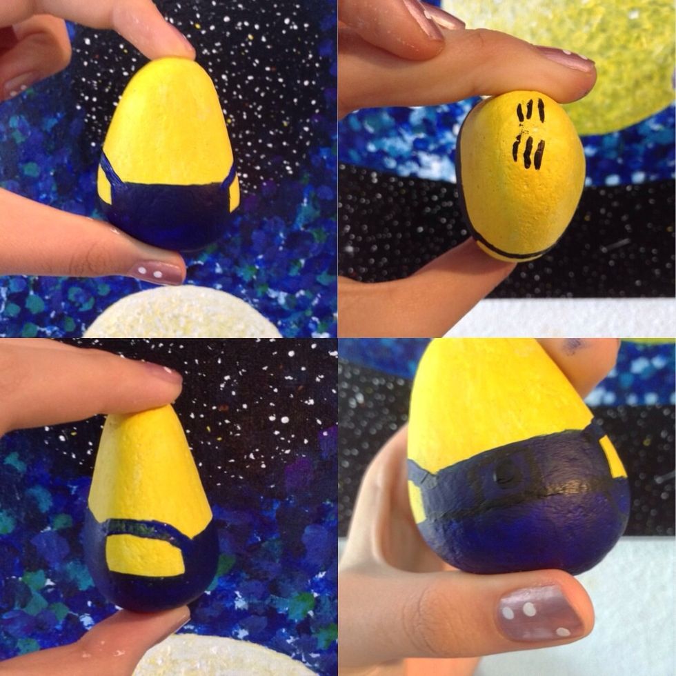 now paint on the straps on the side of the minions shirt. ( draw a line connecting the 2 corners of the square) then add in some details with black(hair, gru sign)