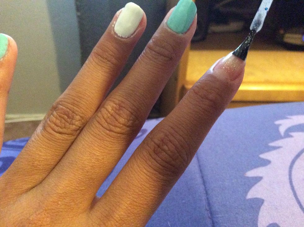 Now paint the pointer finger with the glitter polish