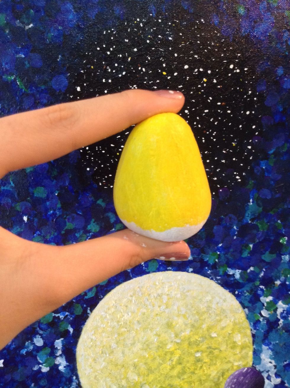 Now paint the rock yellow, but leave the bottom white because we are going to paint the minion pants there.