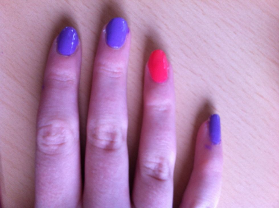 Now paint your ring finger and pink or coral.