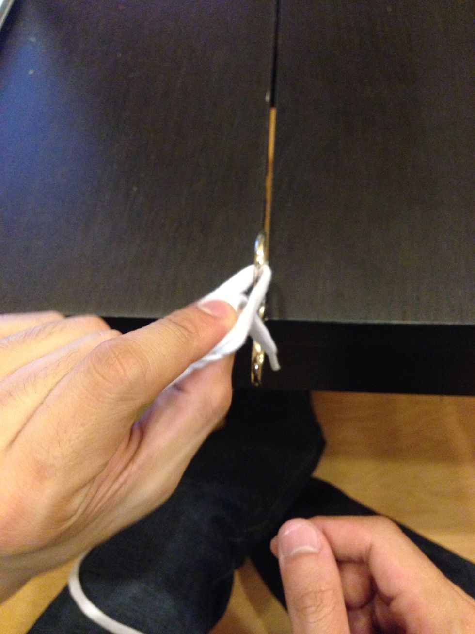 Now pass the free end of the suture back through the loop.