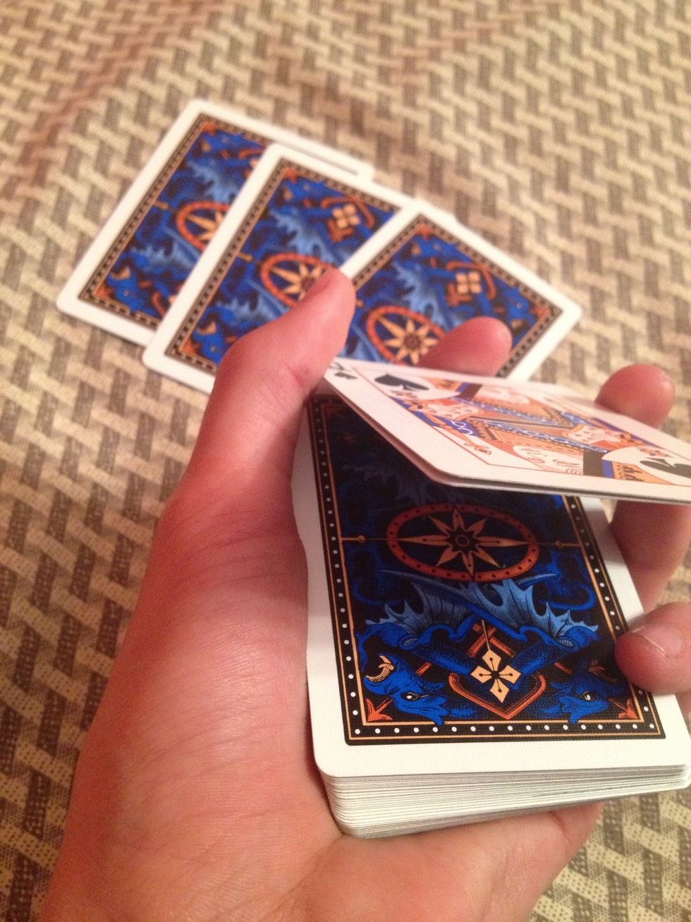 Now pick up two cards, but make it look like one. This is called a double lift.