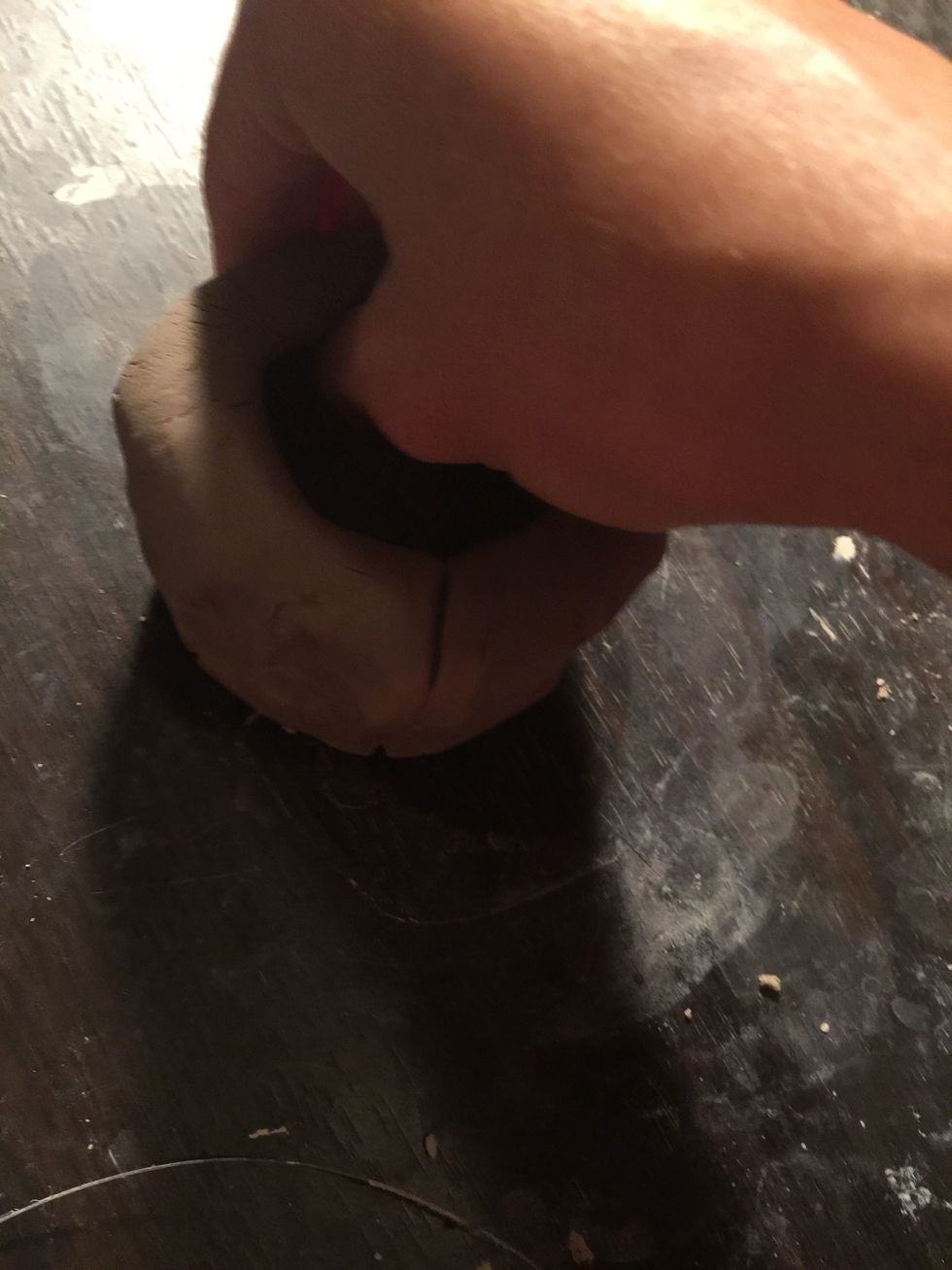 Now pinch out the fatter parts of your clay so that the walls are even all around