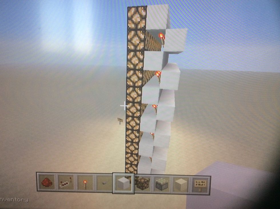 Now place blocks above all the redstone torches.