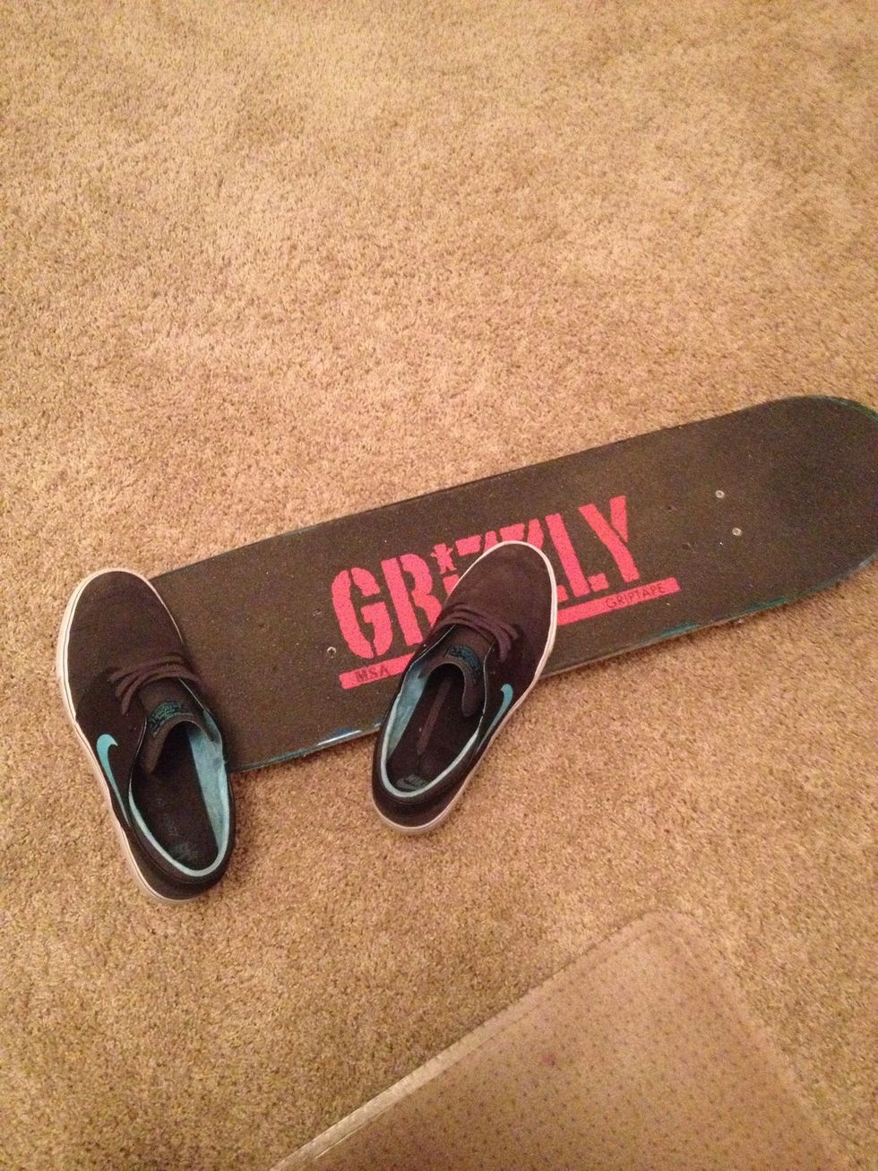 Now place it exactly like a Kickflip, but place your right foot more to the middle of the board.